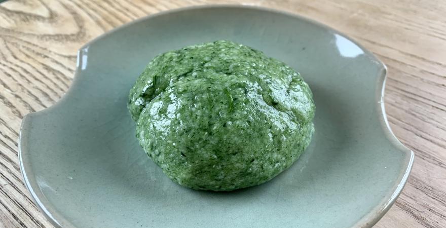 Yomogi mochi on a green plate