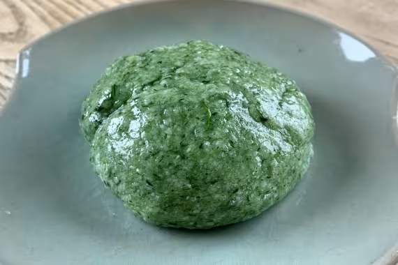 Yomogi mochi on a green plate